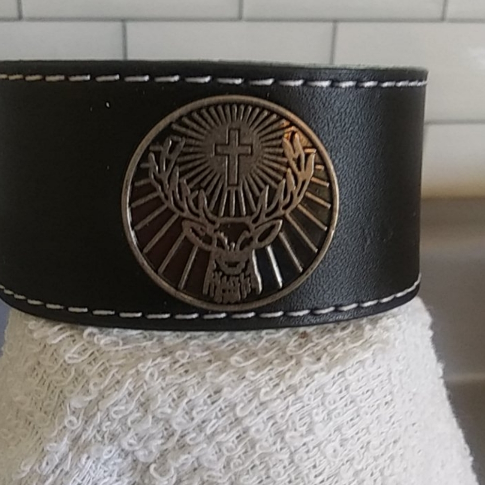 Black leather bracelet with cross